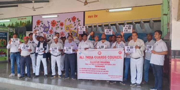 Train guards raising banner against withdrawal of line box for trolley bag recently at the Barwadih railway junction