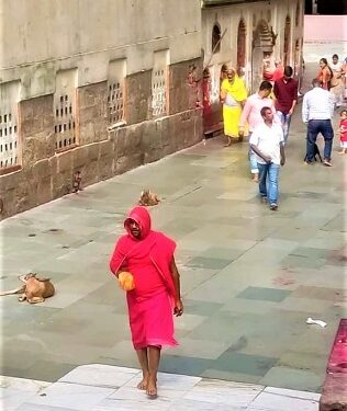 Dahu Yadav in red clothes on way to worship at Kamakhya temple on Friday in Guwahati.