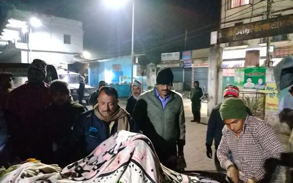 Police official Rudranand Saras at night arranging assistance for the woman in distress