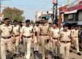 City SP, K Vijay Shankar (at the middle) leading the flag-march on foot near Munsi Mohalla in Mango on Thursday