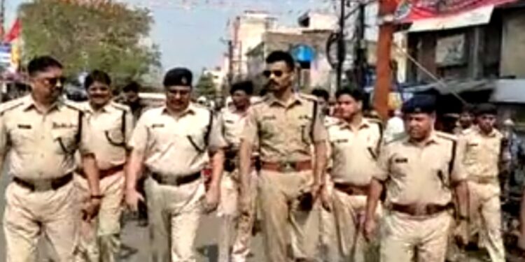 City SP, K Vijay Shankar (at the middle) leading the flag-march on foot near Munsi Mohalla in Mango on Thursday
