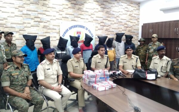 Senior SP, Prabhat Kumar and SP (Rural) Mukesh Lunayat with the nine arrested persons standing behind at the police office on Monday.