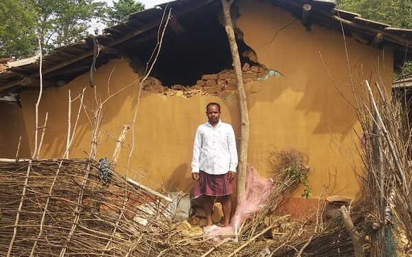 A villager's house damaged by elephants