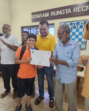 Champion Tanisk Kumar receives trophy and certificate